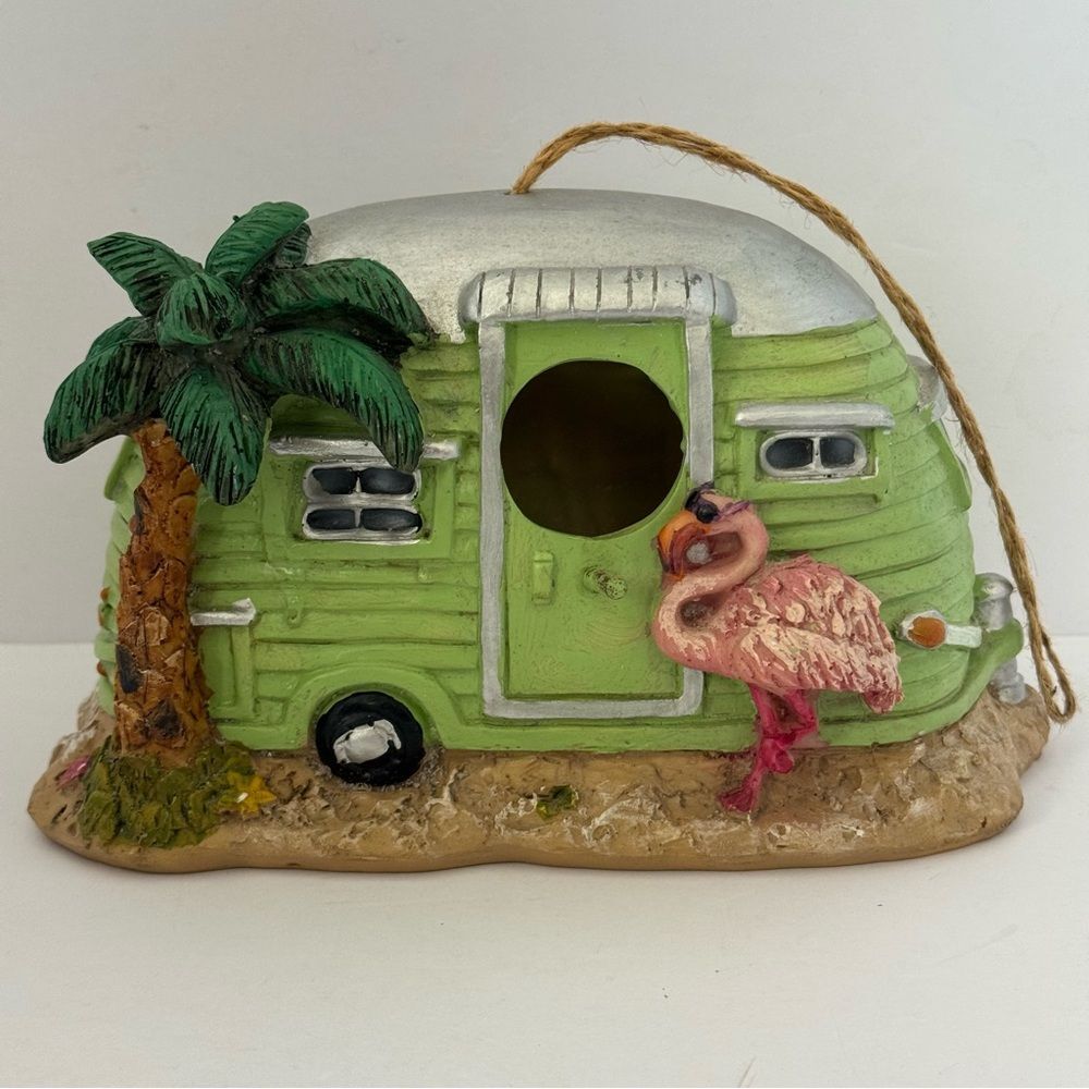 decorative resin RV camper birdhouse with a flamingo and a palm tree